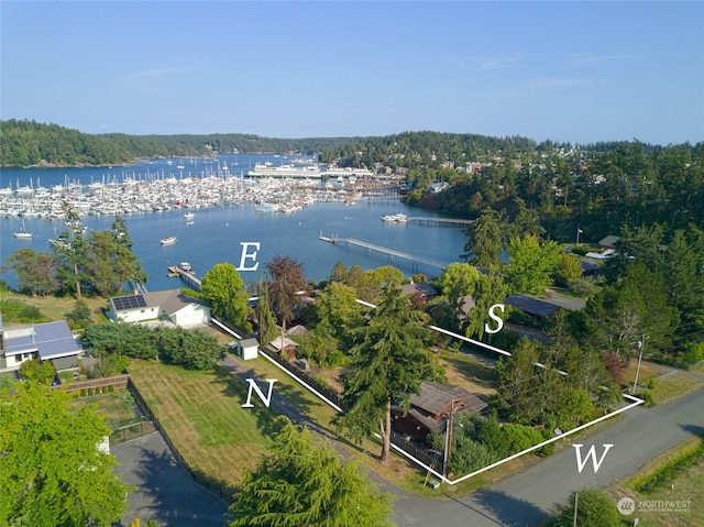 birds eye view of property with a water view