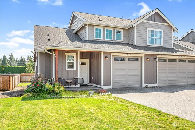 view of front of home featuring a garage and a front yard