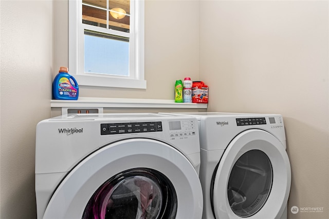 clothes washing area featuring independent washer and dryer