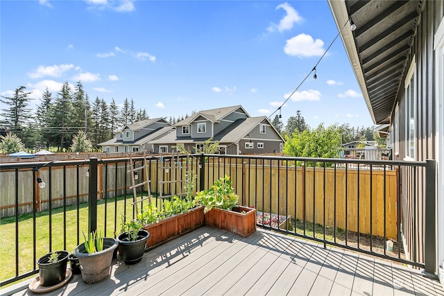 wooden terrace with a yard