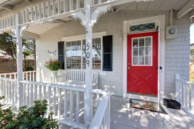 doorway to property with covered porch