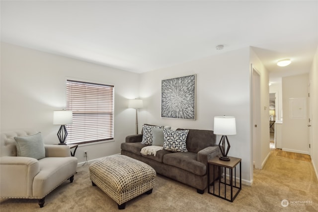 carpeted living room with baseboards