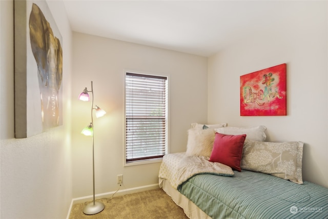 carpeted bedroom with baseboards