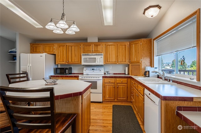 935 Sunrise Dr, Manson, WA 98831 - kitchen featuring white appliances, a sink, light wood-style flooring, and light countertops