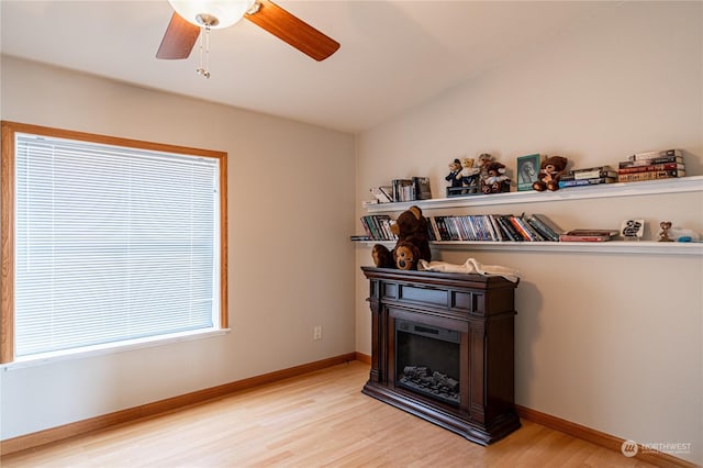 935 Sunrise Dr, Manson, WA 98831 - detailed view of wood finished floors, a ceiling fan, a fireplace, and baseboards