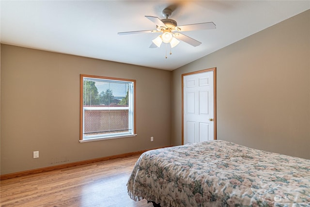 935 Sunrise Dr, Manson, WA 98831 - bedroom with light wood-type flooring, vaulted ceiling, baseboards, and a ceiling fan