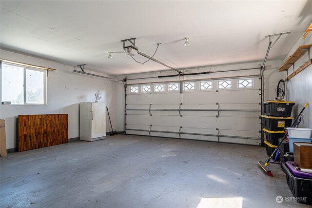 935 Sunrise Dr, Manson, WA 98831 - garage featuring freestanding refrigerator