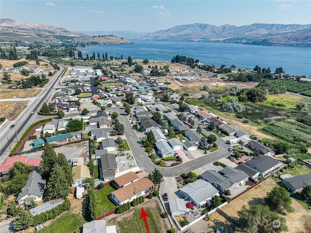 935 Sunrise Dr, Manson, WA 98831 - aerial perspective of suburban area with a water and mountain view