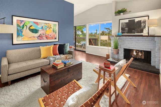 living room featuring dark hardwood / wood-style flooring, a fireplace, and vaulted ceiling