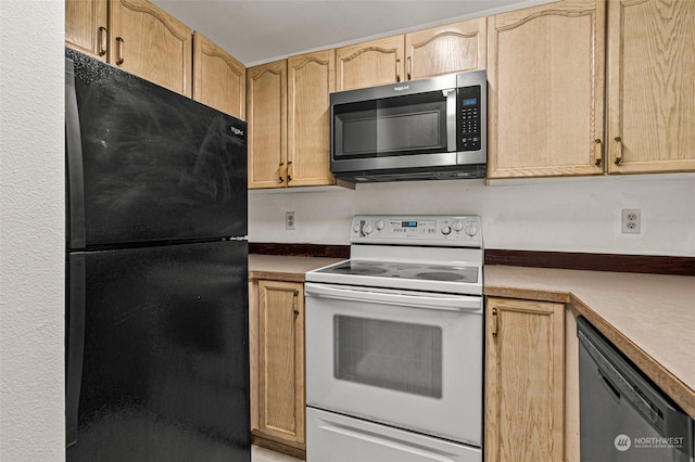 kitchen featuring light brown cabinetry and black appliances