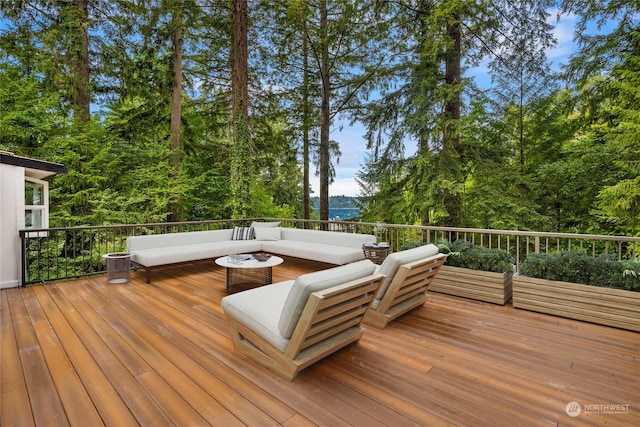 wooden terrace with outdoor lounge area