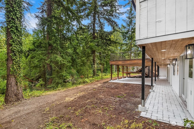 view of yard featuring a wooden deck