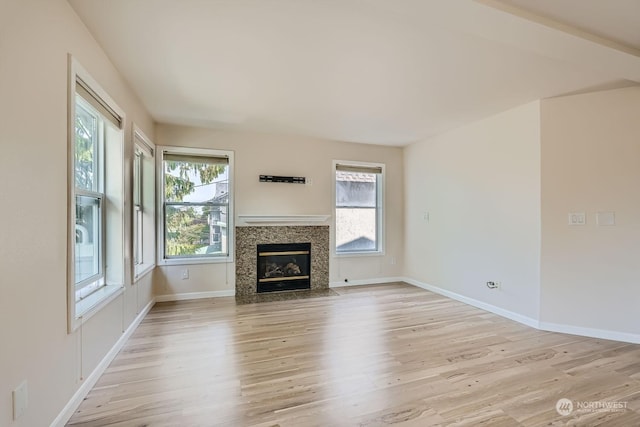 unfurnished living room featuring light hardwood / wood-style flooring