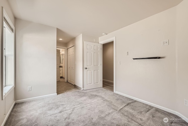 spare room with light colored carpet