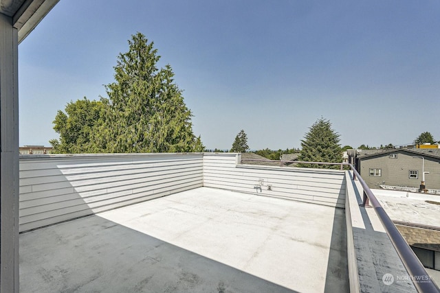 view of patio featuring a balcony