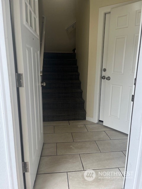 interior space featuring light tile patterned floors