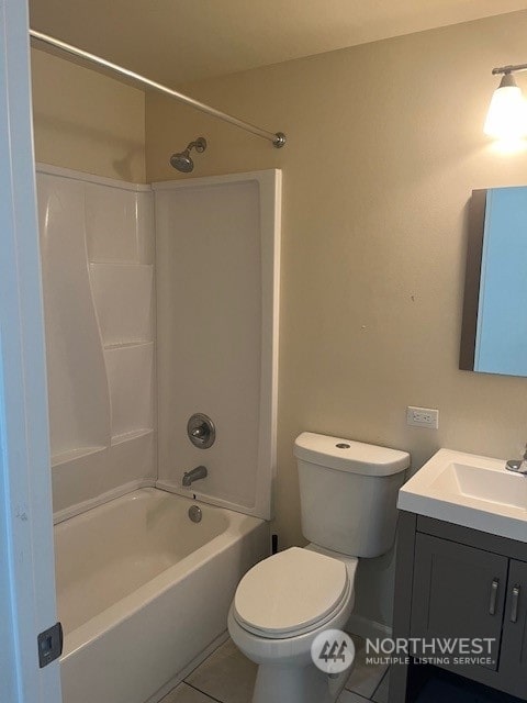 full bathroom with vanity, bathtub / shower combination, toilet, and tile patterned floors