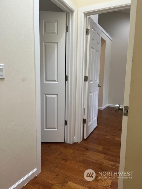 hallway featuring dark hardwood / wood-style flooring