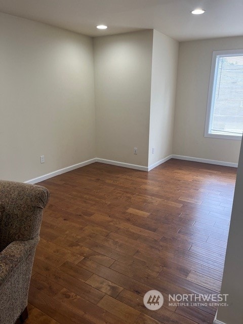 unfurnished room featuring dark hardwood / wood-style floors