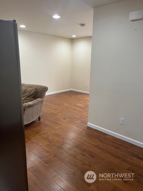 living area with dark hardwood / wood-style floors