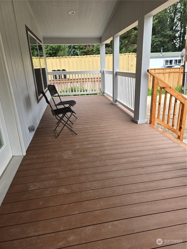 wooden deck featuring covered porch