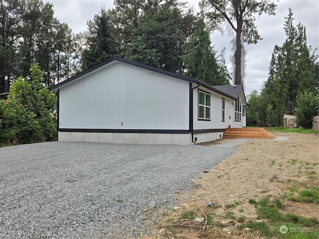 view of property exterior with driveway