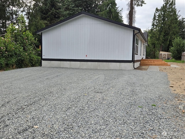 exterior space featuring gravel driveway