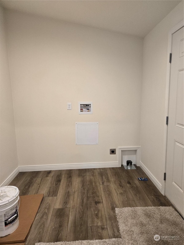 laundry room with laundry area, dark wood-style flooring, hookup for a washing machine, and hookup for an electric dryer