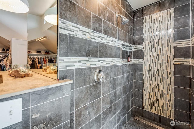 bathroom with a tile shower