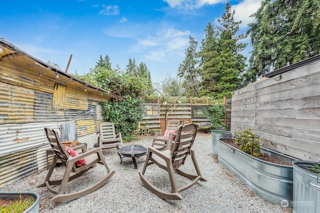 view of patio featuring a fire pit