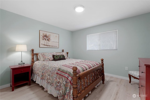 bedroom with light hardwood / wood-style floors