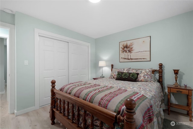 bedroom with a closet and light wood-type flooring