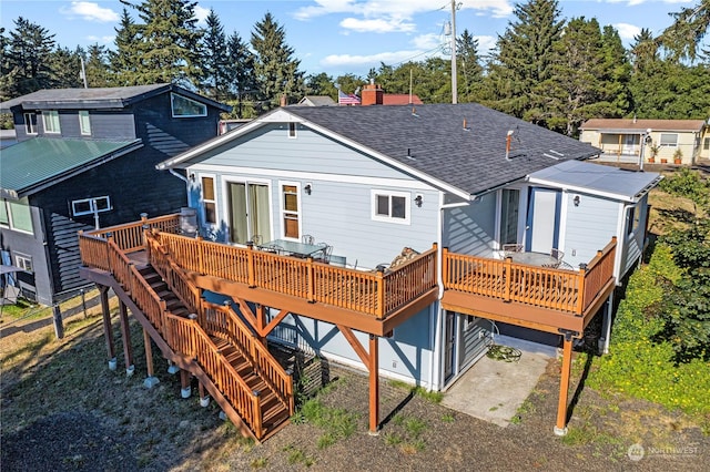 rear view of property with a deck