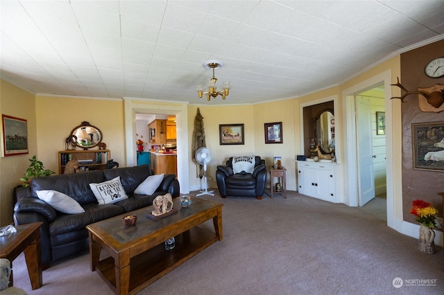 carpeted living room featuring crown molding and an inviting chandelier