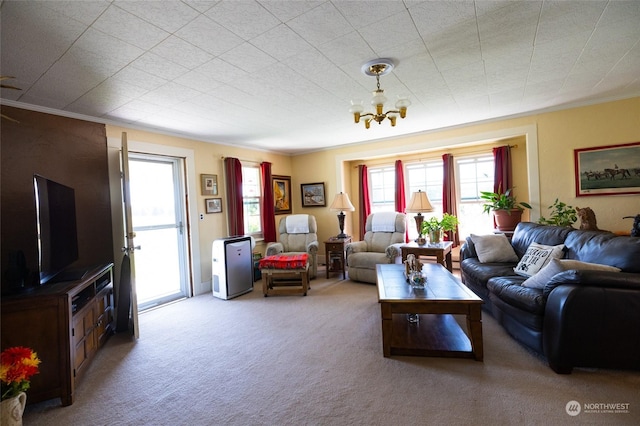 living room with ornamental molding, carpet floors, and a chandelier