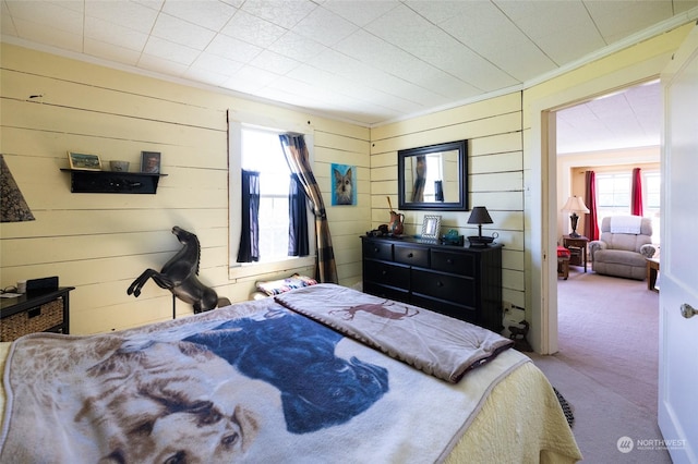 carpeted bedroom with crown molding