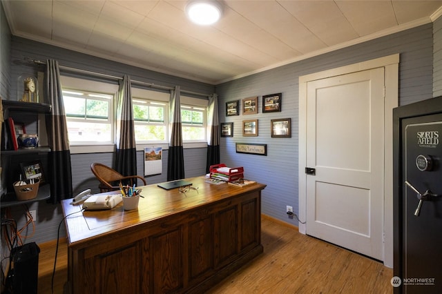 office space with ornamental molding and light hardwood / wood-style floors