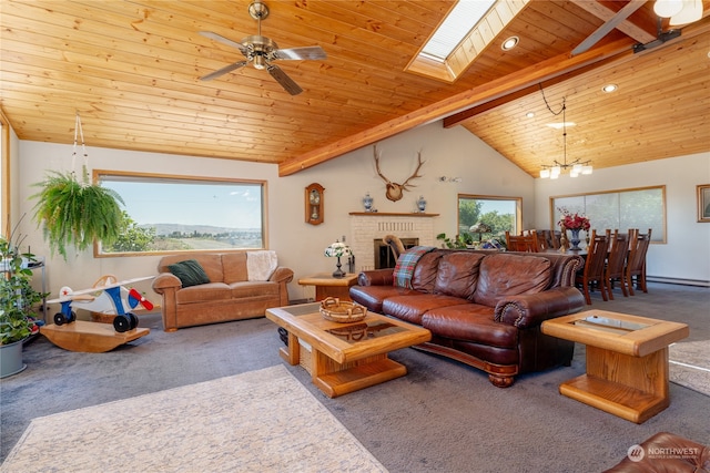 carpeted living room with beam ceiling, wooden ceiling, a skylight, a fireplace, and high vaulted ceiling