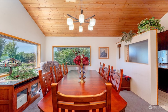 dining room featuring wooden ceiling, light tile patterned floors, and lofted ceiling