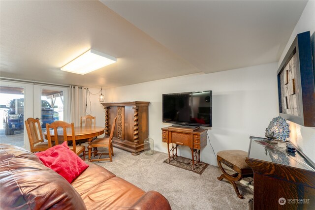 living room with french doors and light colored carpet