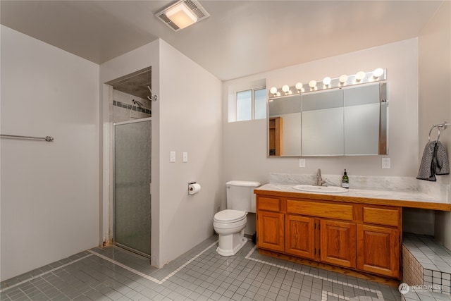 bathroom with walk in shower, tile patterned floors, vanity, and toilet