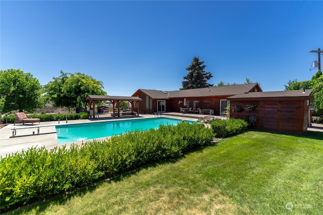 view of pool featuring a patio area and a yard