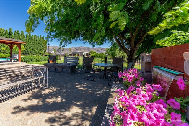 view of patio / terrace featuring a mountain view