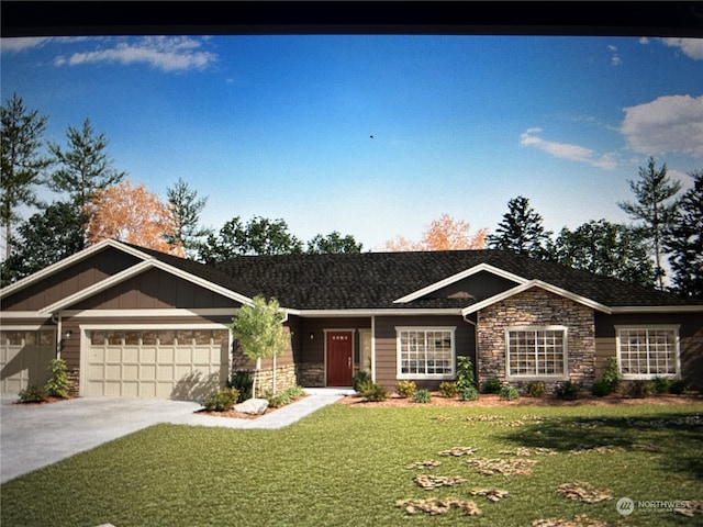 view of front of house featuring a front yard and a garage