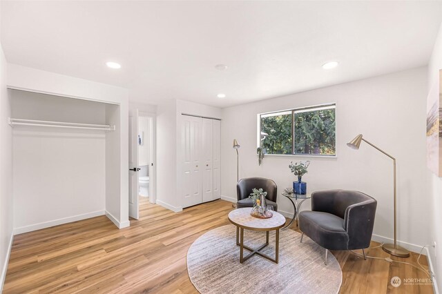 sitting room featuring light hardwood / wood-style flooring