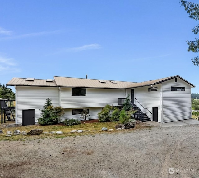 back of property with metal roof