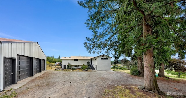 exterior space featuring entry steps and an outbuilding