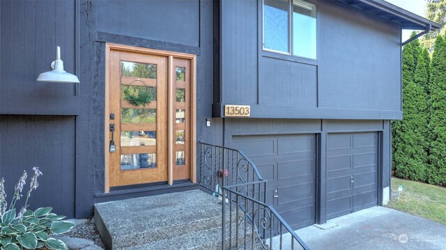 doorway to property featuring a garage