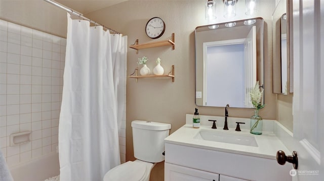 full bathroom with vanity, shower / bath combo, and toilet