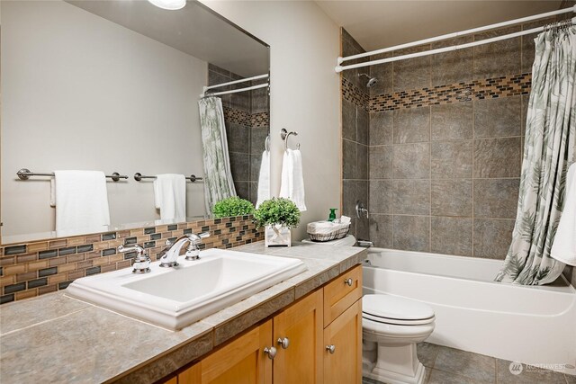 full bathroom with backsplash, shower / bathtub combination with curtain, vanity, and tile patterned floors